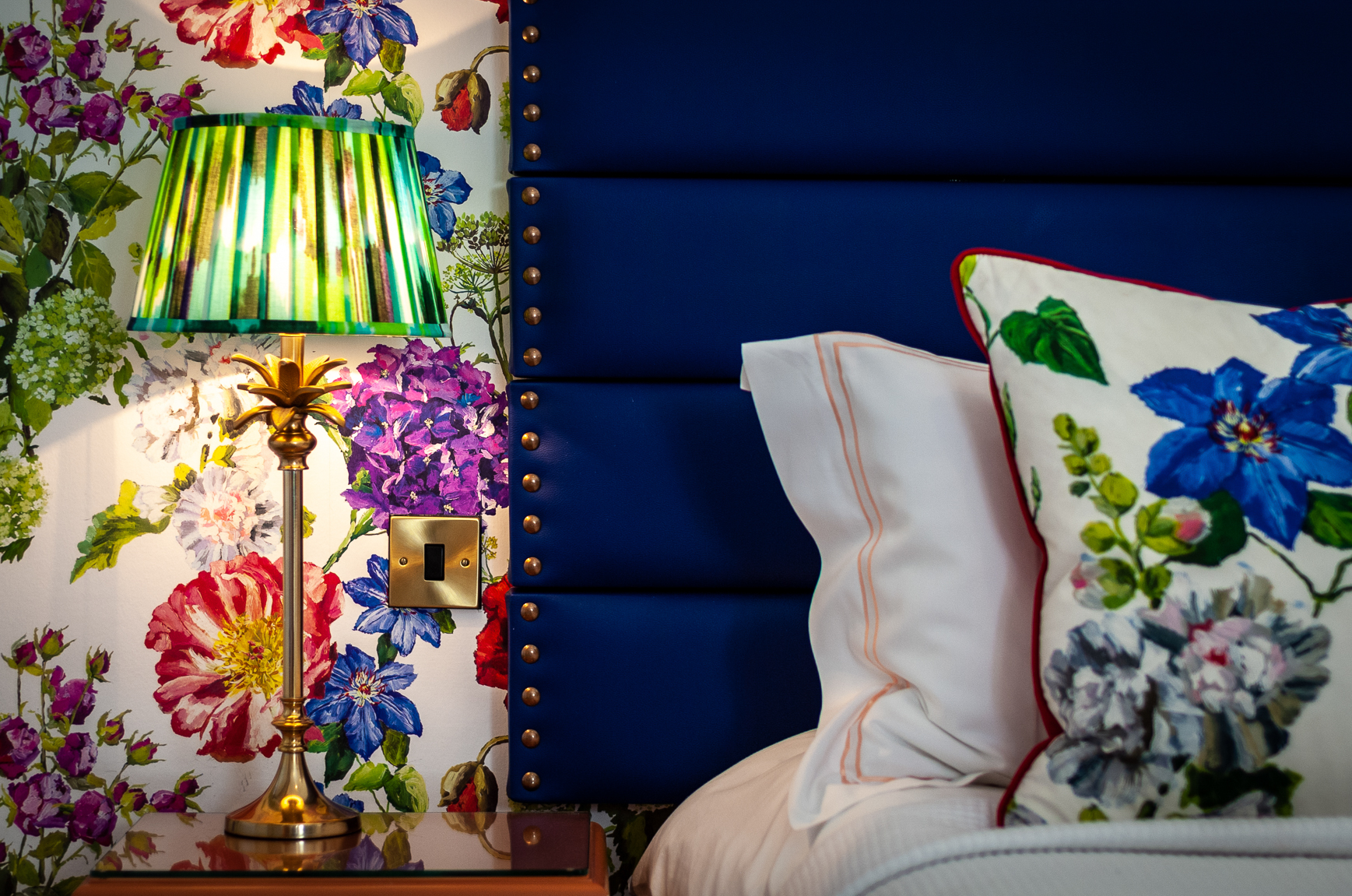 Garden room double bed at Baslow Hall, Derbyshire. Yellow table lamps and Black headboard